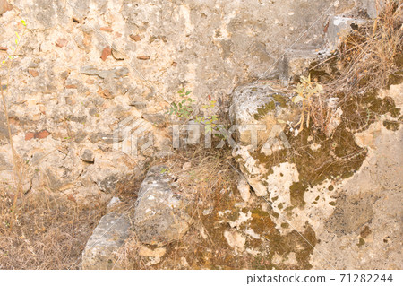 Antique stone wall. Old plaster close up background. Antique stone wall. Old plaster close up background. 71282244
