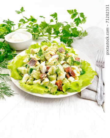 Salad of salmon and avocado on table Salad of salmon and avocado on table 71282331