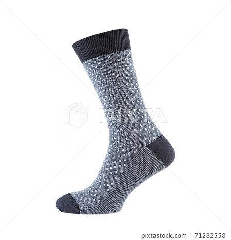 one colored sock is standing on a shape, the shape is not visible, on a white background is isolated 71282558