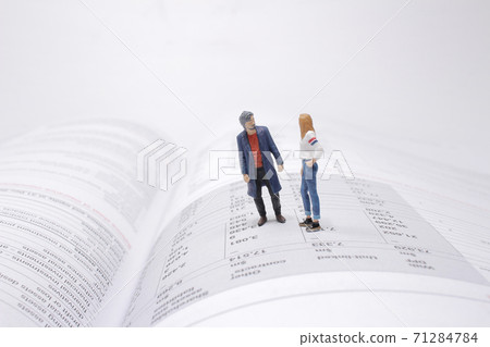 a mini figure stand on the open book a mini figure stand on the open book 71284784