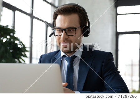 Happy 30s ceo executive manager holding video call. Happy 30s ceo executive manager holding video call. 71287260