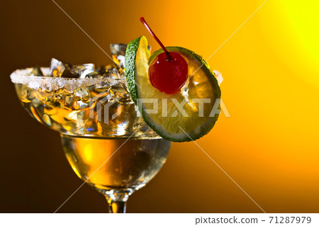 Alcoholic cocktail with cherry and lime. 71287979