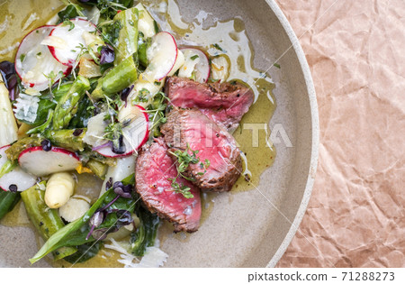 spring salad with barbecue dry aged sliced fillet steak and green and white asparagus spring salad with barbecue dry aged sliced fillet steak and green and white asparagus 71288273