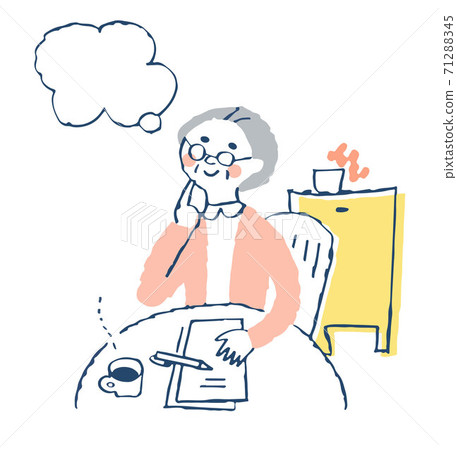 A senior woman writing a letter and a balloon A senior woman writing a letter and a balloon 71288345