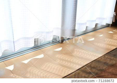 Sunlight through the lace curtains 71288672