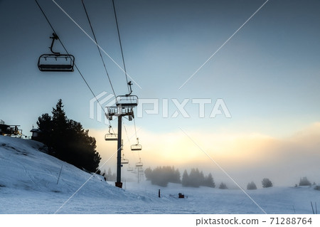 Ski lift at the Alps on the slopes Ski lift at the Alps on the slopes 71288764