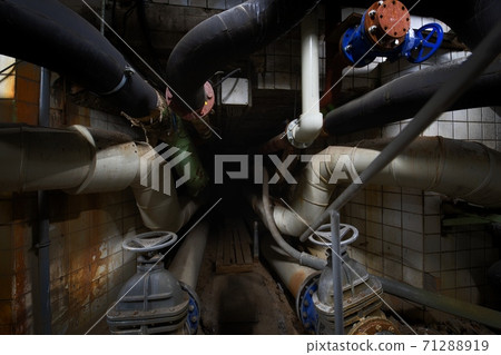 Dark underground tunnel made out of pipes 71288919
