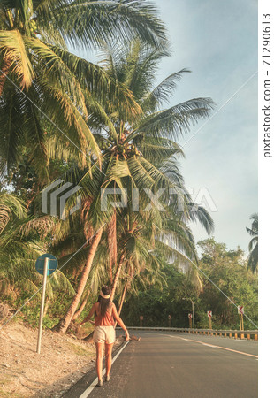 banana tree and palm trees on the road with the girl in Mexico banana tree and palm trees on the road with the girl in Mexico 71290613