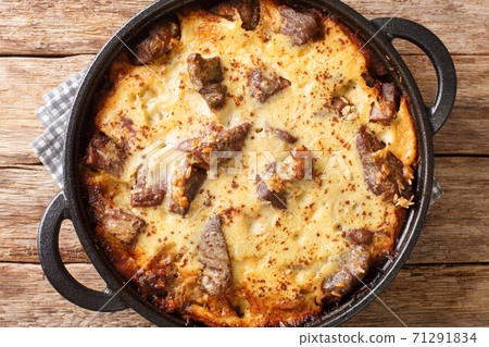 Tave kosi baked lamb and rice with yoghurt close-up in a pan. horizontal top view 71291834