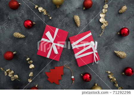 Christmas composition with gifts and golden decoration on dark background. Flat lay, top view Christmas composition with gifts and golden decoration on dark background. Flat lay, top view 71292296