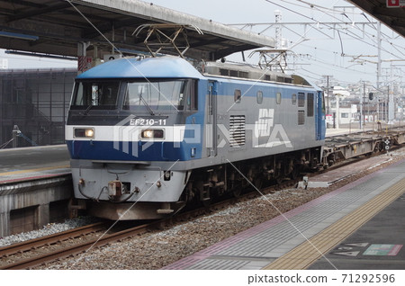EF210 towed down freight train passing through Akashi station 71292596