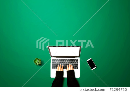 Person using a laptop computer 71294730