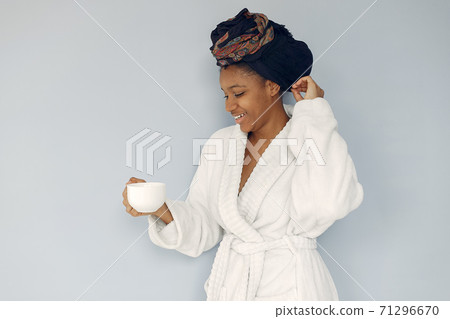 Cute black woman standing on a white background 71296670