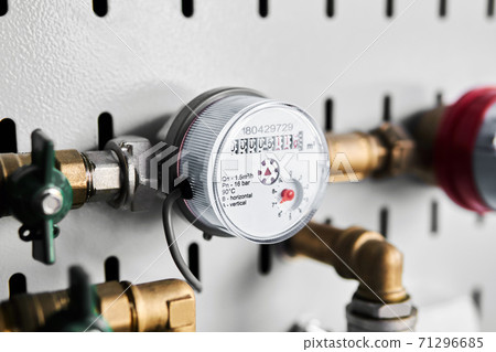 water flow meter installed on the pipeline and connected to remote reading device through cable 71296685