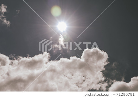 sunbeam blue sky. Bright midday sun ray illuminates the space for overlay nature background sunbeam blue sky. Bright midday sun ray illuminates the space for overlay nature background 71296791