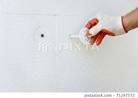 Insulation of the house with polyfoam. 71297572