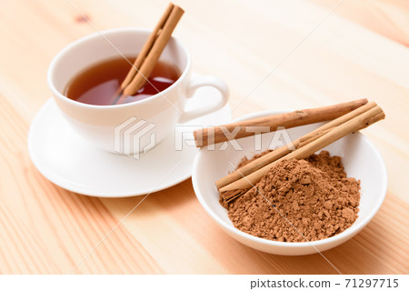 Cinnamon and tea on the table 71297715