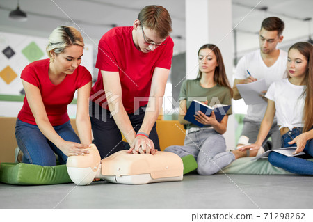 young people learning how to safe a life sitting together on lesson 71298262