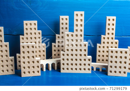 A large city of skyscrapers and overpass flyovers made of figures. Real estate concept. Urbanism and infrastructure. Urbanization, dense high-rise building. Megapolis. City management. Downtown A large city of skyscrapers and overpass flyovers made of figures. Real estate concept. Urbanism and infrastructure. Urbanization, dense high-rise building. Megapolis. City management. Downtown 71299179