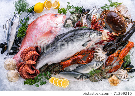 Fresh seafood on ice background. 71299210