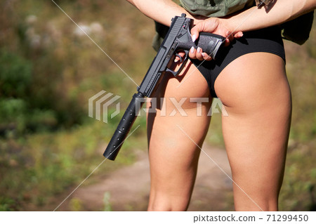 rear view on sportive athletic woman's legs in shorts 71299450
