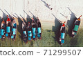 Amazing overhead aerial view of Long Tail Boats on a Thailand Beach Shoreline 71299507