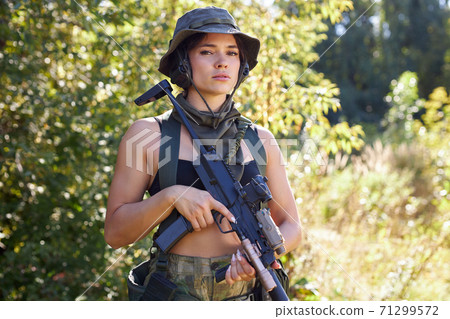 caucasian attractive hunter female in top going to hunt on birds and deers in wild forest caucasian attractive hunter female in top going to hunt on birds and deers in wild forest 71299572
