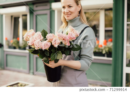 Beautiful bouquet of mixed flowers in woman hand. Floral shop concept . Handsome fresh bouquet. Flowers delivery. Beautiful bouquet of mixed flowers in woman hand. Floral shop concept . Handsome fresh bouquet. Flowers delivery. 71299914