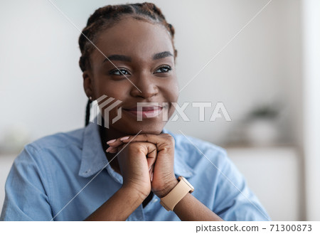 Closeup Portrait Of Dreamy Young Black Woman With Braids Looking Away 71300873