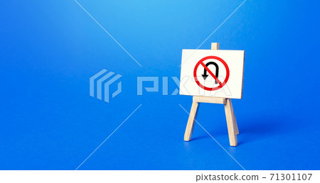 Easel with no turning back traffic sign. Turn arrow and red prohibition symbol. Assertiveness and striving, moving forward without retreating. Finish goals. No way back. Obstinacy, irrevocability 71301107