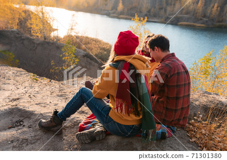 The group of young people are resting in nature 71301380