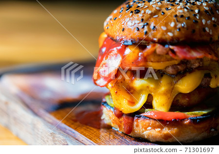 Close up tasty burger with minced meat served on tray 71301697