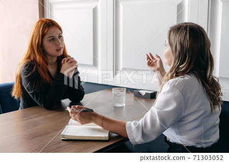 Mental health concept. Communication session of woman psychologist and client. Psychotherapy or talk therapy as help people with variety of mental illnesses and emotional difficulties 71303052