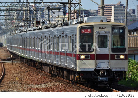 Express train (10030 series) entering Shingashi Station on the Tobu-Tojo Line 71303935