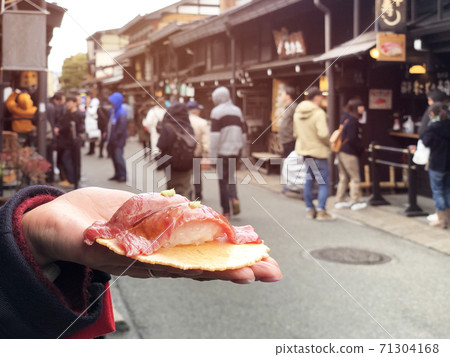 Japanese street food close-up Hida Beef Sushi and cracker at Takayama, Japan 71304168
