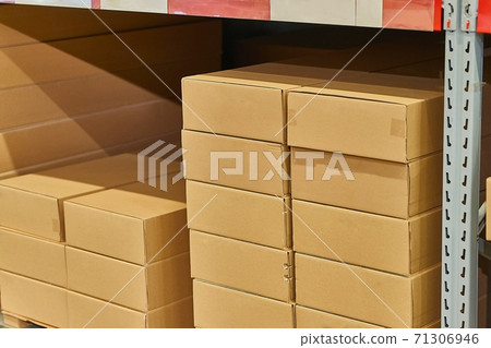 Warehouse stocked with boxes in stacks 71306946