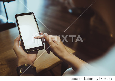 Woman hand use smartphone to do work business, social network, communication in public. Woman hand use smartphone to do work business, social network, communication in public. 71308283