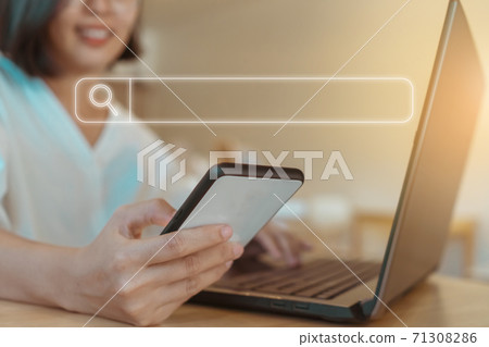People hand using mobile phone or smartphone searching for information in internet online society web with search box icon. People hand using mobile phone or smartphone searching for information in internet online society web with search box icon. 71308286