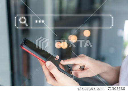 People hand using mobile phone or smartphone searching for information in internet online society web with search box icon. People hand using mobile phone or smartphone searching for information in internet online society web with search box icon. 71308388