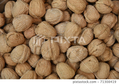 Natural walnut background pattern texture Abstract walnuts heap pattern background Blurred edges frame Natural food in-shell nuts walnuts pattern backdrop Natural walnut background pattern texture Abstract walnuts heap pattern background Blurred edges frame Natural food in-shell nuts walnuts pattern backdrop 71308419
