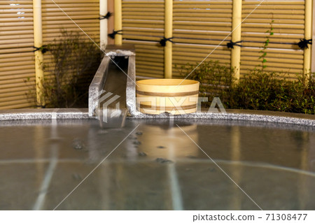 An open-air hot spring bath with a free-flowing source 71308477