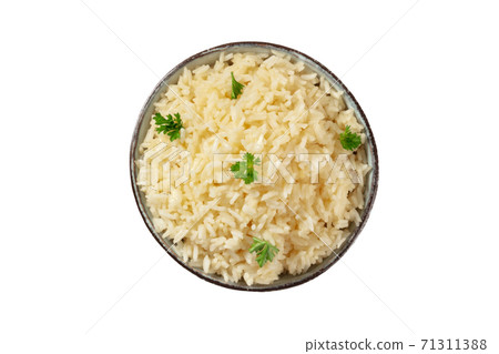 Rice, shot from above, isolated on a white background with a clipping path. Minimal dish, cooked, served with fresh parsley Rice, shot from above, isolated on a white background with a clipping path. Minimal dish, cooked, served with fresh parsley 71311388