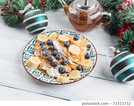 Christmas tree shaped crepes with quark, blueberry Christmas tree shaped crepes with quark, blueberry 71313732