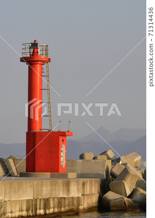 Photographing the morning scenery of the red lighthouse at the Irifune fishing port in Hakodate, Hokkaido 71314436