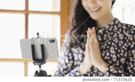 Young woman doing live streaming 71315628