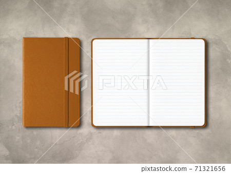 Leather closed and open lined notebooks on concrete background Leather closed and open lined notebooks on concrete background 71321656