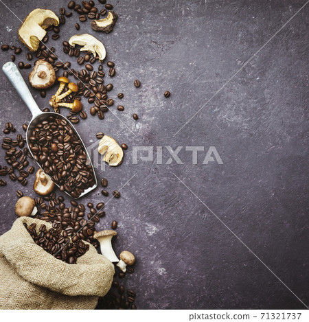 Mushroom Chaga Coffee Superfood Trend-dry and fresh mushrooms and coffee beans on dark background. Copy space, top view. Concept of trend modern food industry. Mushroom Chaga Coffee Superfood Trend-dry and fresh mushrooms and coffee beans on dark background. Copy space, top view. Concept of trend modern food industry. 71321737