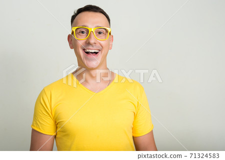 Portrait of handsome man with yellow shirt Portrait of handsome man with yellow shirt 71324583