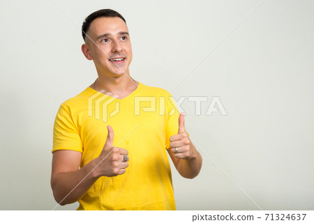 Portrait of handsome man with yellow shirt 71324637