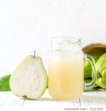 Guava juice guava wood background beverage fruit cold drink drink dieting glass fresh fruit milkshake healthy fresh tropical Guava juice guava wood background beverage fruit cold drink drink dieting glass fresh fruit milkshake healthy fresh tropical 71327207